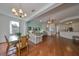Bright dining room with hardwood floors and chandelier at 2620 Newcomb Ct, Sun City Center, FL 33573