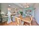 Charming dining area with hardwood floors and view to kitchen at 2620 Newcomb Ct, Sun City Center, FL 33573