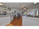 Open kitchen with breakfast bar and view of living area at 2620 Newcomb Ct, Sun City Center, FL 33573