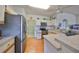 Modern kitchen with stainless steel appliances and ample counter space at 2620 Newcomb Ct, Sun City Center, FL 33573