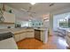 Spacious kitchen featuring stainless steel appliances and light wood flooring at 2620 Newcomb Ct, Sun City Center, FL 33573