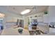 Bright kitchen with stainless steel appliances and an island at 2620 Newcomb Ct, Sun City Center, FL 33573