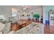 Comfortable living room with hardwood floors and a view of the kitchen at 2620 Newcomb Ct, Sun City Center, FL 33573