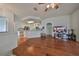 Spacious living room with hardwood floors and open concept design at 2620 Newcomb Ct, Sun City Center, FL 33573