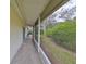 Relaxing screened patio with table and chairs, overlooking lush landscaping at 2620 Newcomb Ct, Sun City Center, FL 33573