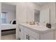 Double vanity bathroom with access to bedroom at 2920 Evergreen Elm Pass, Wesley Chapel, FL 33543
