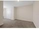 Well-lit bedroom with double doors and wall-to-wall carpet at 2920 Evergreen Elm Pass, Wesley Chapel, FL 33543