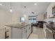 Open concept kitchen with island, granite countertops, and stainless steel appliances at 2920 Evergreen Elm Pass, Wesley Chapel, FL 33543