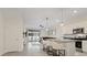 Modern kitchen with white cabinets, granite countertops, and stainless steel appliances at 2920 Evergreen Elm Pass, Wesley Chapel, FL 33543