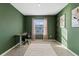 Home office with desk, chair, and natural light at 2920 Evergreen Elm Pass, Wesley Chapel, FL 33543