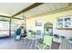 Covered patio with seating area and ceiling fan at 3613 S Omar Ave, Tampa, FL 33629