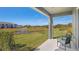 Relaxing patio overlooking a pond with fountain at 5019 Gilded Bard Ct, Wimauma, FL 33598
