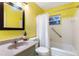 Bathroom with a white shower curtain, a gray vanity, and a large mirror at 538 Southwest N Blvd, St Petersburg, FL 33703