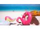 Tropical beach scene with turquoise waters and playful inflatables, perfect for a vacation getaway at 538 Southwest N Blvd, St Petersburg, FL 33703