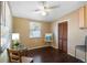 Bedroom with a ceiling fan, a window with blinds, and dark colored laminate flooring at 538 Southwest N Blvd, St Petersburg, FL 33703