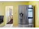 Stainless steel Samsung refrigerator with digital display enhances this eat-in kitchen space at 538 Southwest N Blvd, St Petersburg, FL 33703