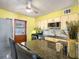 Eat-in kitchen featuring granite countertops, gas range, stainless steel appliances, and bar seating at 538 Southwest N Blvd, St Petersburg, FL 33703