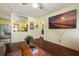 Open-concept living area with hardwood floors, a TV, and a view into the kitchen at 538 Southwest N Blvd, St Petersburg, FL 33703