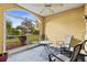 Cozy screened patio with small table and chairs at 6319 Sunset Bay Cir, Apollo Beach, FL 33572