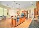 Open kitchen with large island, stainless steel appliances, and breakfast bar at 8478 Dunham Station Dr, Tampa, FL 33647