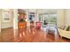 Open living area with hardwood floors, comfortable seating and access to patio at 8478 Dunham Station Dr, Tampa, FL 33647