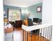 Functional office space featuring hardwood floors, desk and windows, perfect for productivity at 15625 Morning Dr, Lutz, FL 33559