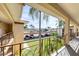 View from balcony overlooking landscaped grounds and parking at 19029 Us Highway 19 N # 3-13, Clearwater, FL 33764