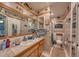 Bathroom with a shower, toilet, and vanity with a wood cabinet at 19029 Us Highway 19 N # 3-13, Clearwater, FL 33764