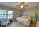 Spacious bedroom with a king-size bed and large window at 19029 Us Highway 19 N # 3-13, Clearwater, FL 33764