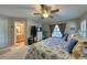 Main bedroom with king bed and en-suite bathroom at 19029 Us Highway 19 N # 3-13, Clearwater, FL 33764