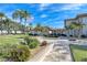 Landscaped grounds of community featuring a walkway and building at 19029 Us Highway 19 N # 3-13, Clearwater, FL 33764