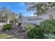 Imperial Cove community entrance with stonework and landscaping at 19029 Us Highway 19 N # 3-13, Clearwater, FL 33764