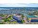Building aerial highlighting waterfront access at 19029 Us Highway 19 N # 9-301, Clearwater, FL 33764