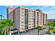 Multi-story building with parking and tropical landscaping at 19029 Us Highway 19 N # 9-301, Clearwater, FL 33764