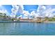 Community waterfront view with a dock and lush landscaping at 19029 Us Highway 19 N # 9-301, Clearwater, FL 33764