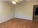 Spacious bedroom with laminate wood flooring and neutral walls at 2255 Philippine Dr # 35, Clearwater, FL 33763