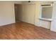 Bright bedroom with laminate floors and mirrored vanity at 2255 Philippine Dr # 35, Clearwater, FL 33763