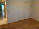Spacious bedroom with laminate floors and mirrored closet doors at 2255 Philippine Dr # 35, Clearwater, FL 33763