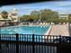Inviting community pool with surrounding lounge chairs at 2255 Philippine Dr # 35, Clearwater, FL 33763