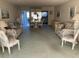 Open living and dining area with carpeted floor and furniture at 2255 Philippine Dr # 35, Clearwater, FL 33763