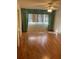Living room with laminate wood flooring and window coverings at 2255 Philippine Dr # 35, Clearwater, FL 33763
