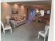Open living and dining area with carpeted floor and furniture at 2255 Philippine Dr # 35, Clearwater, FL 33763