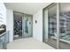 Spacious balcony with glass railings and sliding glass doors at 301 1St S St # 804, St Petersburg, FL 33701