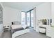 Bright bedroom with city views, queen bed, and vanity at 301 1St S St # 804, St Petersburg, FL 33701