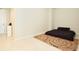 Simple bedroom with a dark-colored queen bed and rug at 301 1St S St # 804, St Petersburg, FL 33701