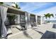 Relaxing poolside cabanas with comfortable seating and privacy curtains on a sunny day at 301 1St S St # 804, St Petersburg, FL 33701