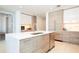 Modern kitchen with light wood cabinets, island, and stainless steel appliances at 301 1St S St # 804, St Petersburg, FL 33701