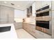 Modern kitchen with light wood cabinets, stainless steel appliances, and a large island at 301 1St S St # 804, St Petersburg, FL 33701