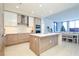 Bright, modern kitchen with wooden cabinets, a large center island, and an open layout at 301 1St S St # 804, St Petersburg, FL 33701