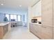 Modern kitchen featuring sleek cabinets, stainless steel appliances, and an adjacent dining area at 301 1St S St # 804, St Petersburg, FL 33701